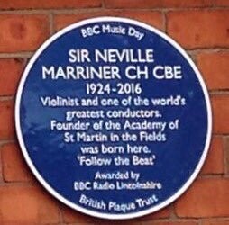 Traditional-style blue-and-white plaque on Neville Marriner’s childhood home in Lincoln, including advice to all musicians: ‘Follow The Beat’.