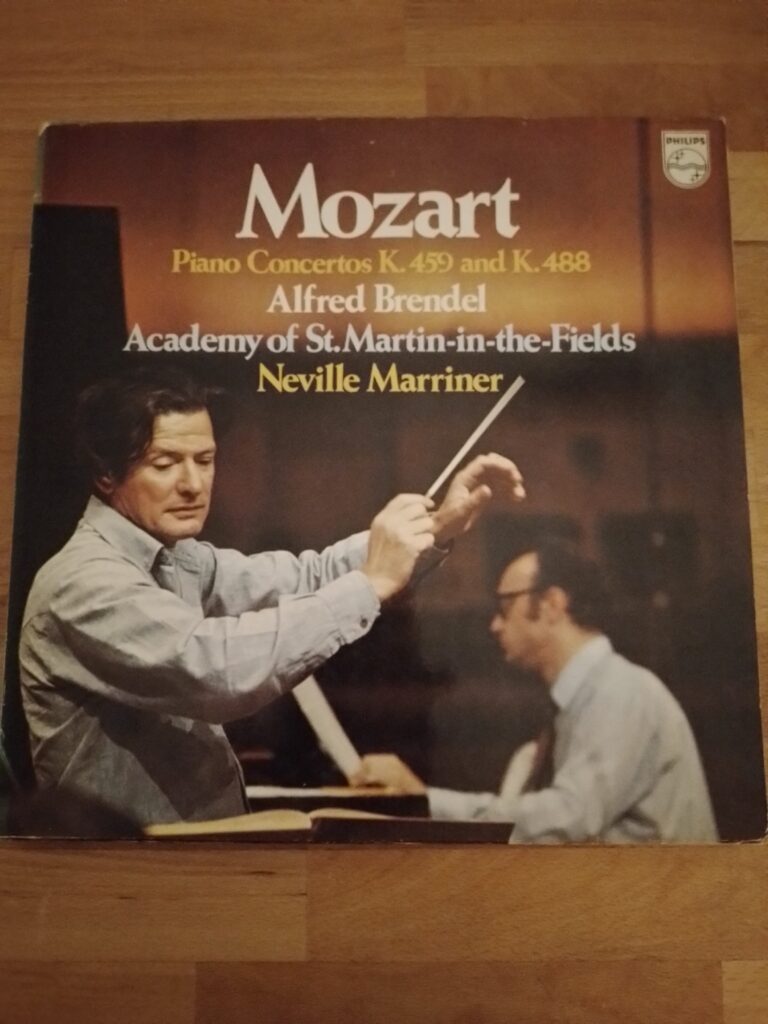 A colour photo for a Philips LP, with Alfred Brendel, out-of-focus at the back, while the attention is on Neville Marriner conducting at the front; another interesting nuance of marketing.