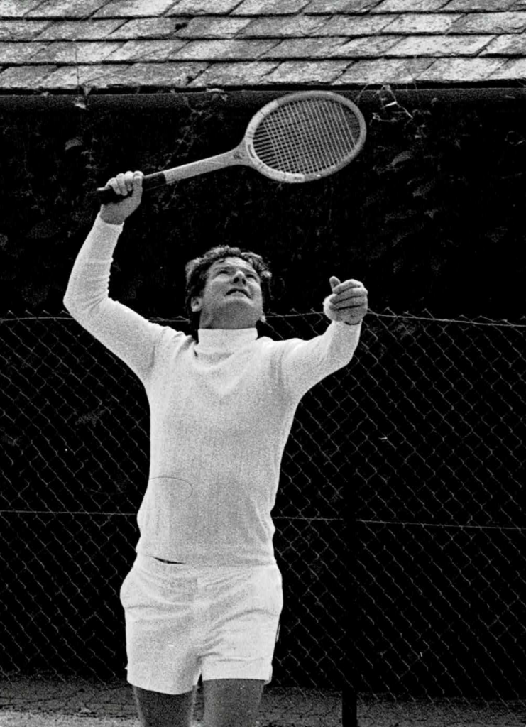 Neville Marriner found his way onto the tennis court whenever he could, to the end of his long life. He is shown here in colour, delivering a first serve (note ball in left hand for a second – if required).