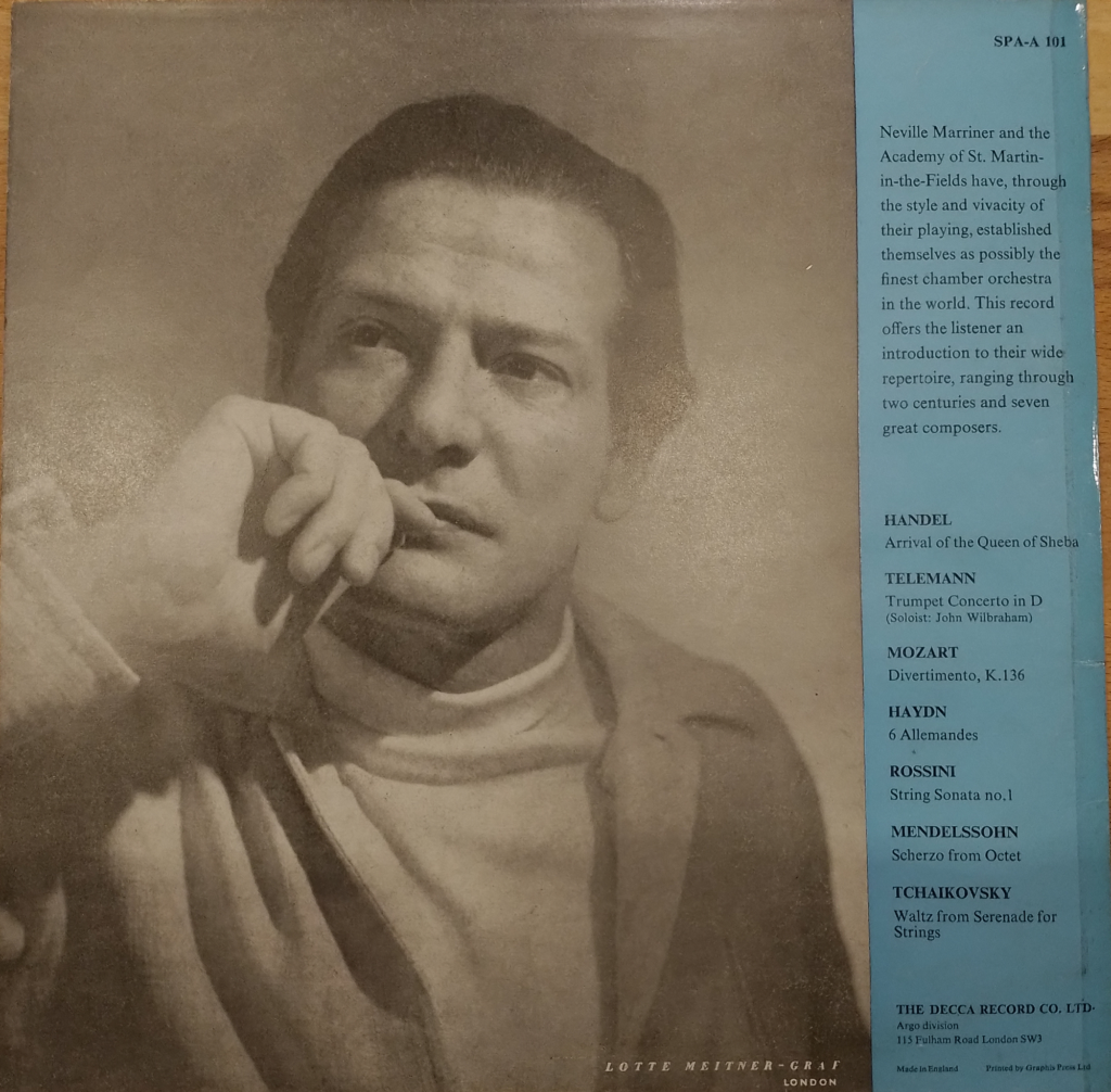 A thoughtful-looking Neville Marriner, including trademark white polo-neck top, occupying three-quarters of the back of an Argo LP sleeve for ‘The World of the Academy’ circa 1967. The director’s personal image was becoming significant in the marketing of ASMF.
